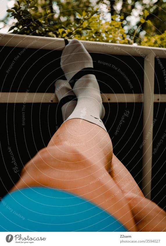 Cycling legs Legs Sportsperson Athlete Muscular cycling shorts bike socks relaxation Put one's feet up Relaxation Balcony at home holidays free time Summer Sun