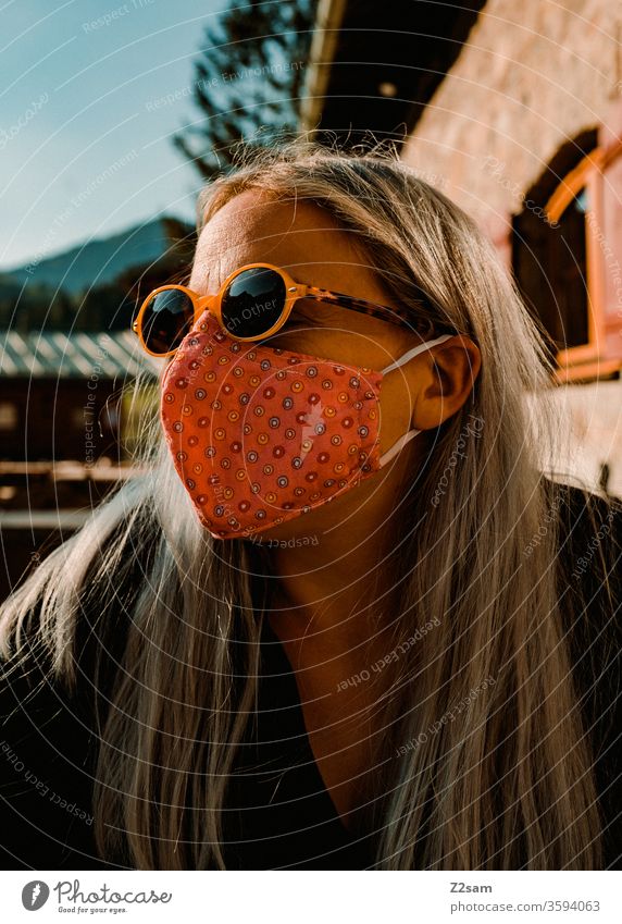 Woman with Corona mask in the beer garden Mask corona Virus Beer garden Bavaria Protection Sunglasses Healthy Infection Social life public portrait Blonde