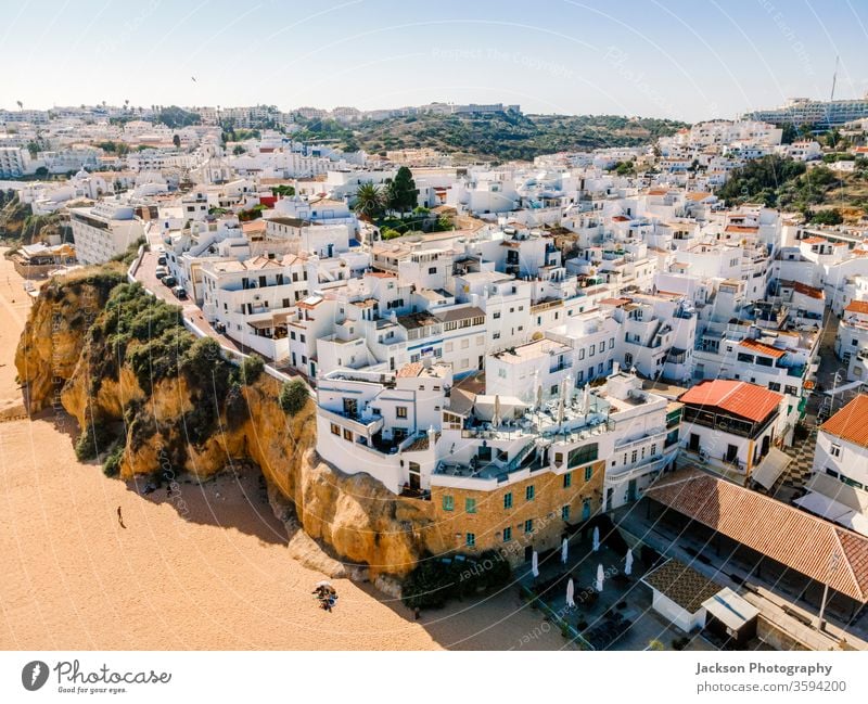 Aerial view of seaside Albufeira in Algarve, Portugal. architecture portugal albufeira beach aerial ocean white city town pier nature outdoor building