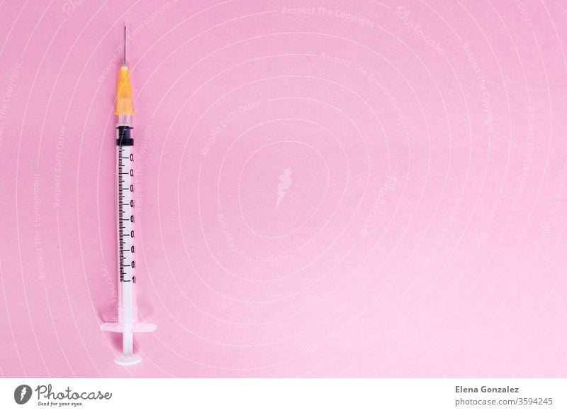 Top view syringe on pink background for coronavirus prevention. Covid-19 kit. Copy Space. Medical concept. epidemic vaccine diagnostic Flat lay medical covid