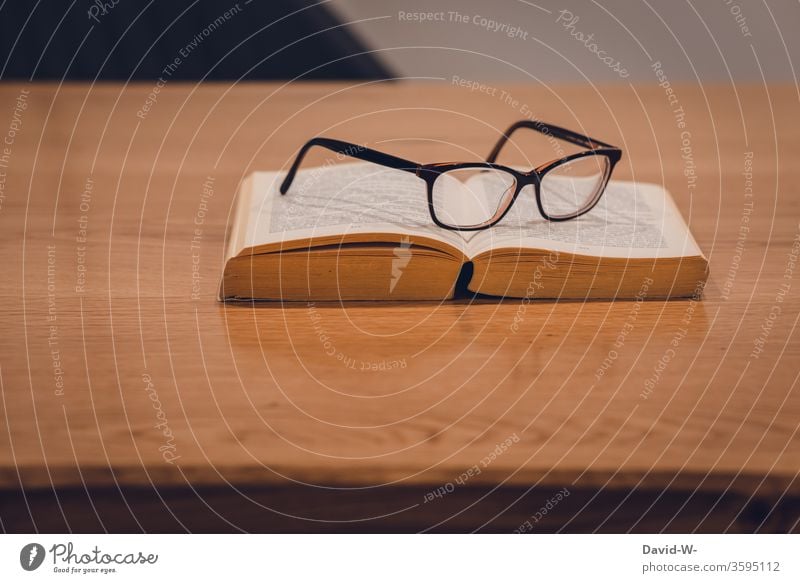 Reading glasses are on the book on a table Old books defective copy Book Education formed Study Parquet floor wooden floor Page Academic studies School