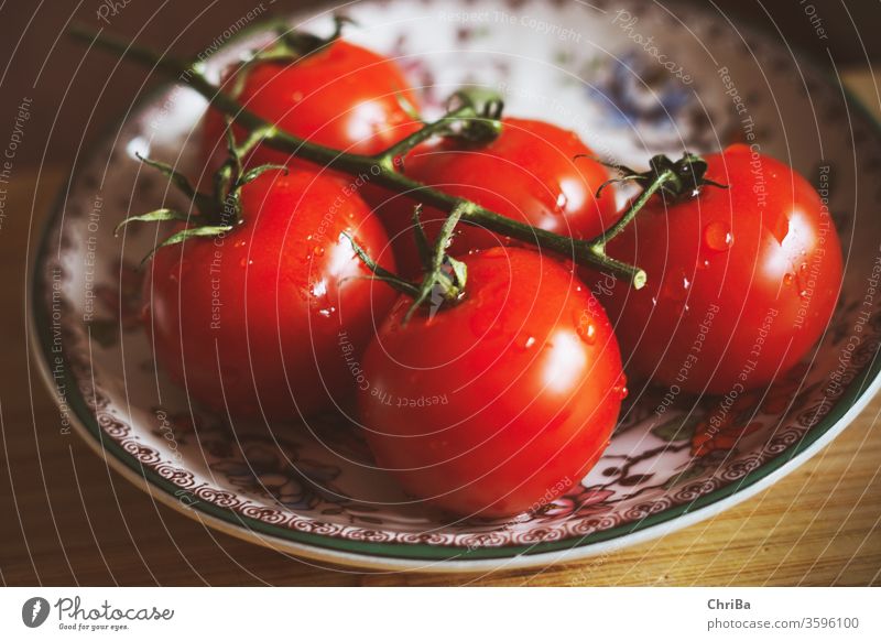 Fresh panicles of tomatoes on a colourful plate To enjoy Delicious Healthy Eating Vegetarian diet Close-up Colour photo Food fruit food and drink Nutrition