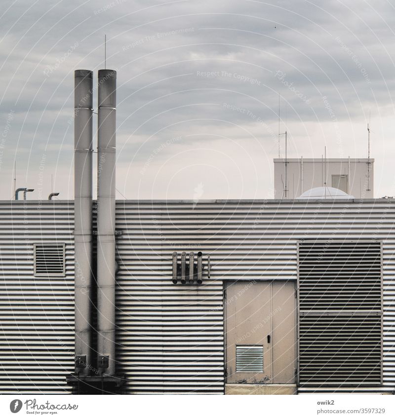 tin Facade Boiler house Metal Corrugated sheet iron door Chimney Trigger lines Parallel Detail Sky Clouds Evening Wall (building) Exterior shot Deserted
