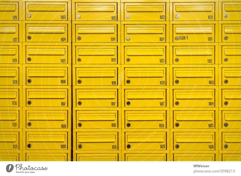 Many yellow mailboxes, numbered Mailbox Yellow Metal series slits mail slot Numbers Residential accommodation Student accommodation floor Story Keyhole open