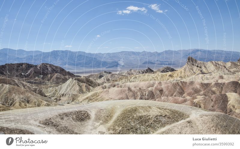 Zabriskie Point on the Death Valley Sand Dune Art outdoors Landscape Landscape format Landing colorful Color gradient Deserted Fossil arid Sandstone Sky aridity