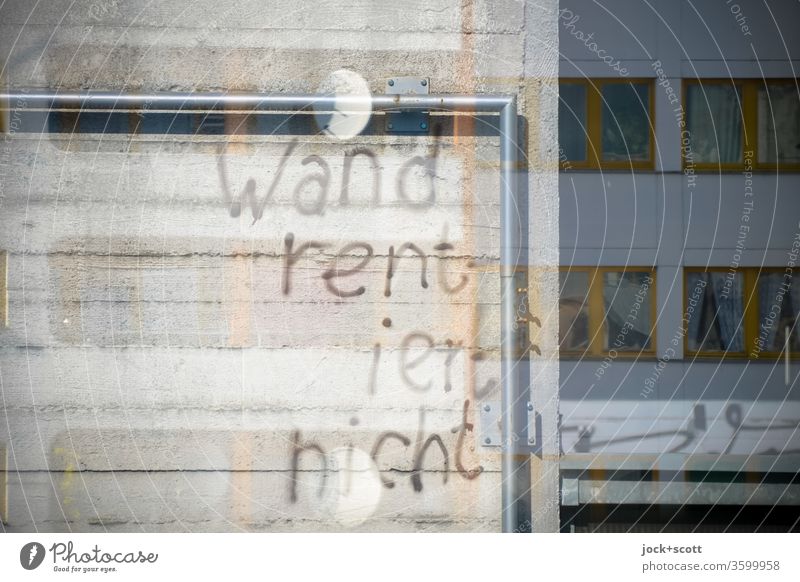 Wall does not pay for reflection Word Facade Architecture Idea background Reflection Handwriting Wall (building) Characters Frame Metal post Street art Daub