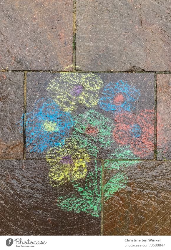 rainy bouquet of flowers, painted with street chalk on natural stones Chalk street-painting chalk Street painting Bouquet variegated Natural stone