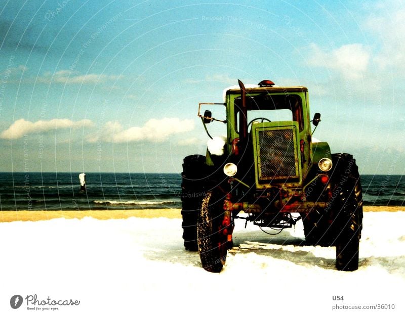 tractive power Tractor Beach Coast Winter Cold Transport Water Sky Sun Snow