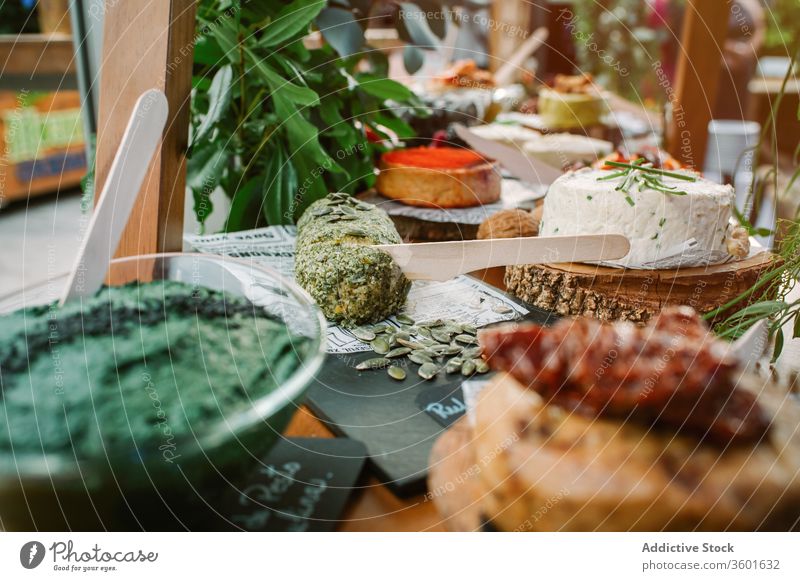 Table with various palatable dishes food assorted delicious meal gourmet cuisine cottage cheese greenery garnish tasty bread pumpkin seed fresh organic yummy