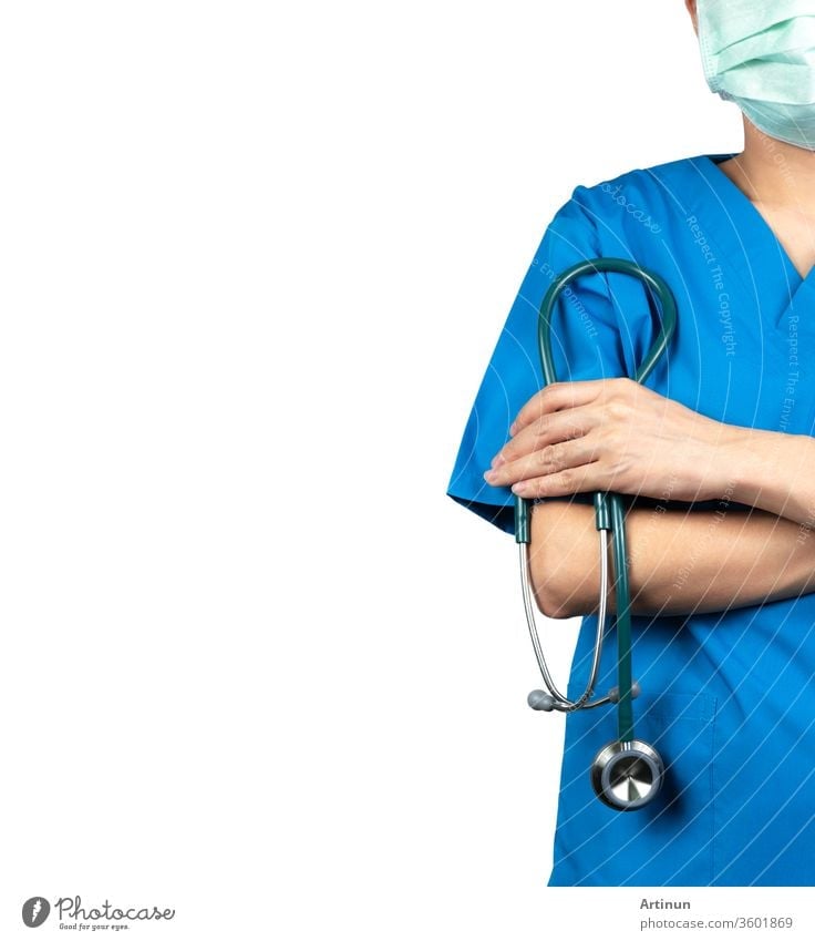 Surgeon doctor wear blue scrubs shirt uniform and green face mask. Physician stand with arms crossed and hand holding stethoscope. Healthcare professional. Surgeon doctor stand with confidence. Trust.