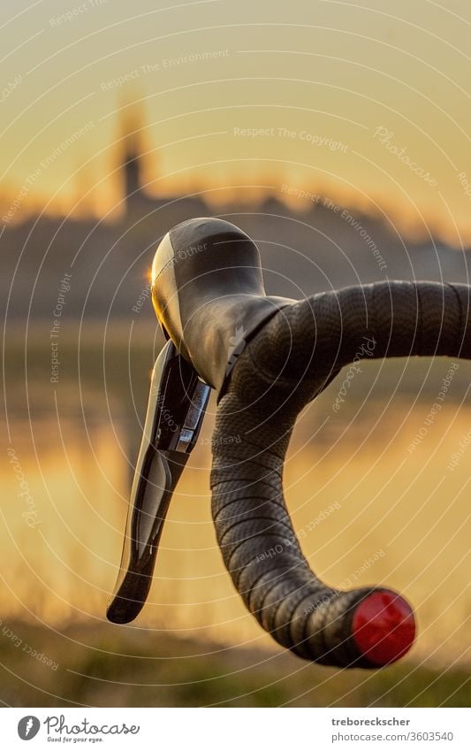 Bicycle handlebars in front of skyline in the evening light bicycle bike sport road biking speed black ride cyclist isolated dresden brake city element design