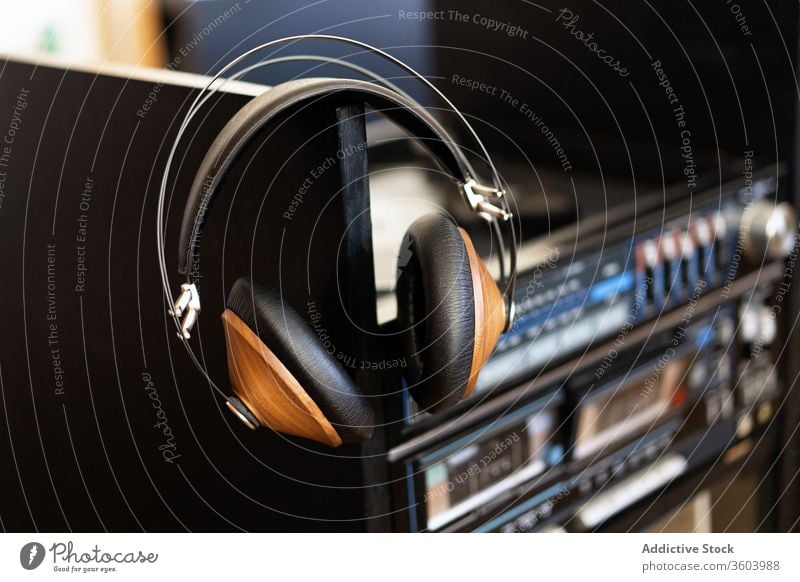 Headphones on a record player audio disc vinyl turntable music sound analog retro studio black equipment background album club entertainment nightclub party