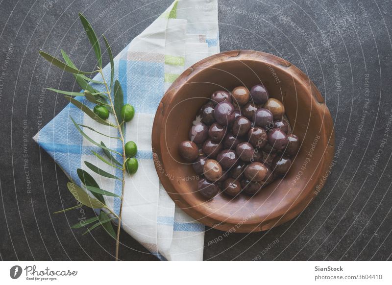Olives in vintage plate olive oil olives background virgin extra rustic wood greek healthy cooking food home italian ingredient raw spanish concept nature green
