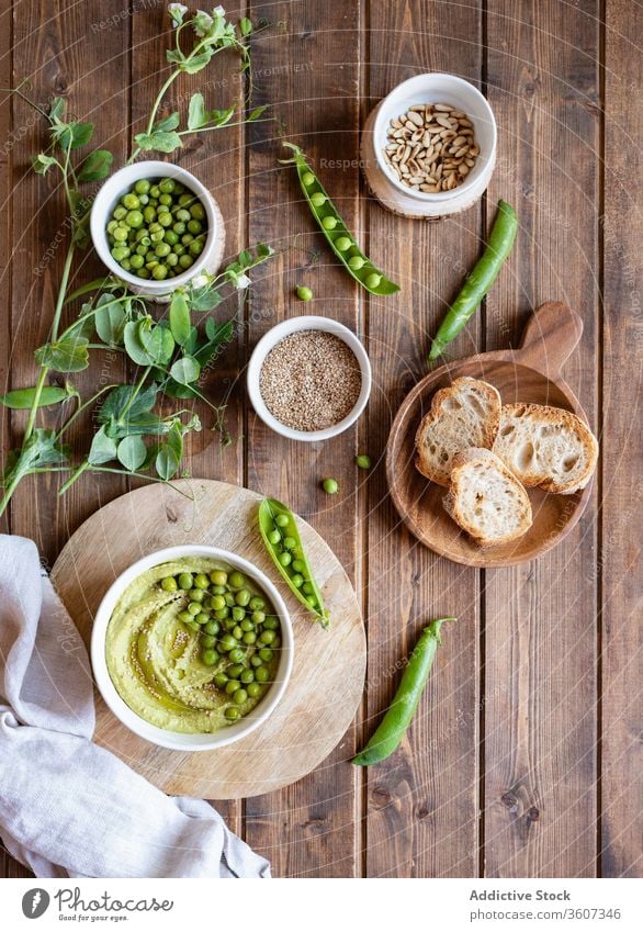 Hummus with green pea and bread hummus food natural tasty appetizer starter serve ingredient cook fresh nutrition healthy delicious cuisine meal homemade