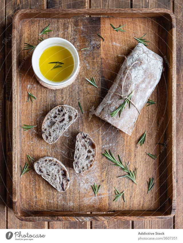 Fresh bread with olive oil and herbs ciabatta italian rosemary fresh tradition food rustic delicious wooden cuisine meal nutrition tasty serve homemade loaf