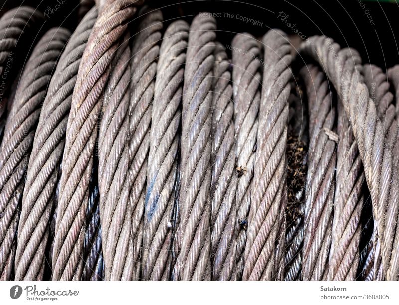 Old sling cable of electric winch in front of 4wd car steel old metal equipment vehicle rust rope gear hoist tow close up help pull off road