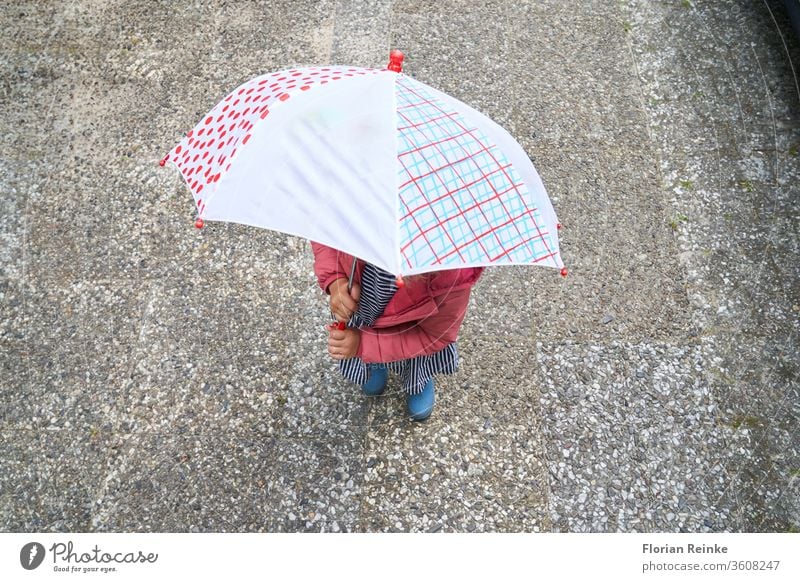 four-year-old girl with umbrella and rubber boots Autumn Beauty & Beauty Blonde Boots Cheerful Child City Colour Dress Woman fun Funny Girl Happiness Jump Legs