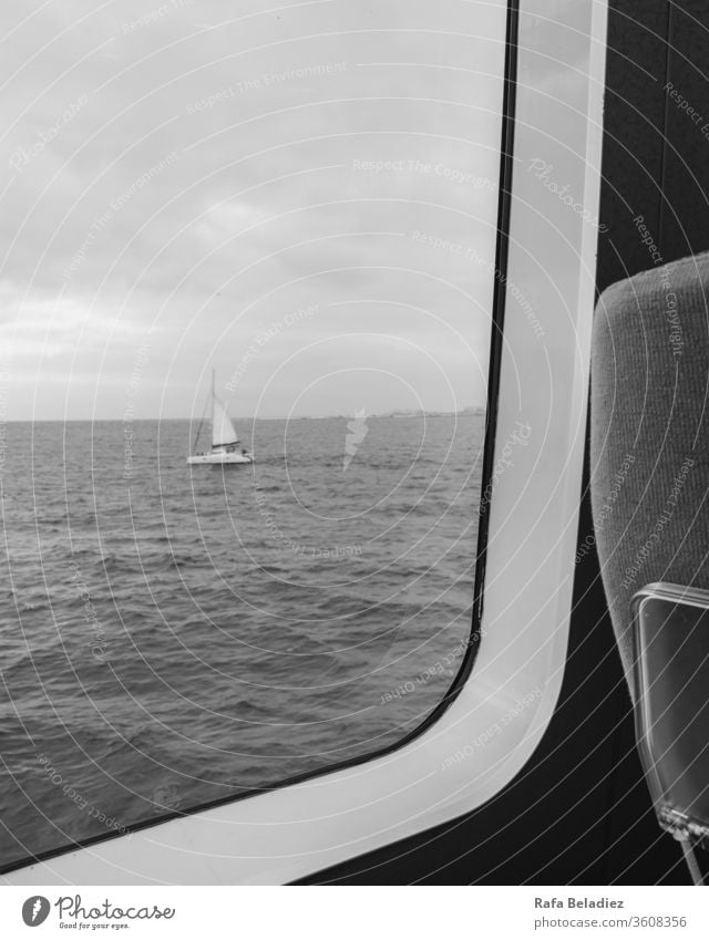 Sailboat seen from inside a ferry Ocean Baltic Sea Summer Sailing Sailing ship Water Maritime Beach life Handicraft flag Vacation & Travel paper boat Freedom
