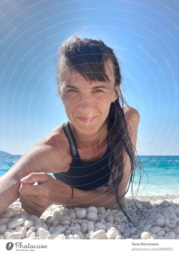 Selfie on a stone beach Beach Adults Woman Ocean Nose ring stones Sun luck Contentment