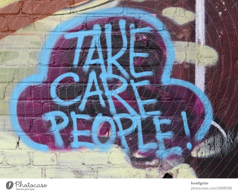 Blue graffiti on a brick wall Graffiti Caution people Lifestyle Emotions Exterior shot Speech bubble variegated Colour photo Wall (building) Day Wall (barrier)