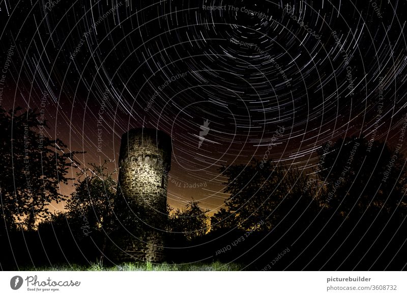 Star trails above the old watchtower stars Starry sky Sky startrails Watch tower clear Night Forest Light Restless Time Deserted rotation rotation axis