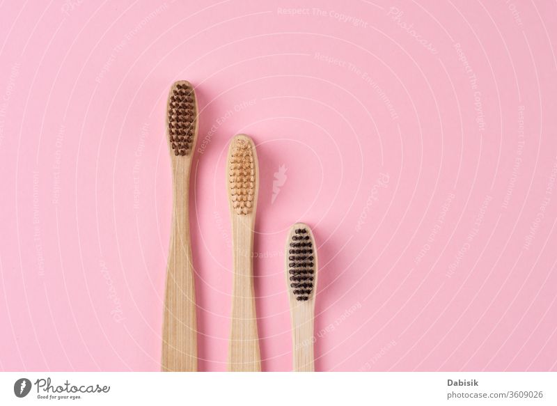 Bamboo toothbrushes on pink background. Zero waste concept bamboo eco friendly wooden organic teeth bathroom care hygiene dental health ecological oral dentist