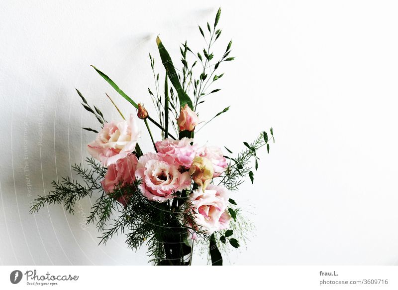 A friendly floral greeting with grasses, lisianthus and asparagus. Bouquet flowers leaves Vase