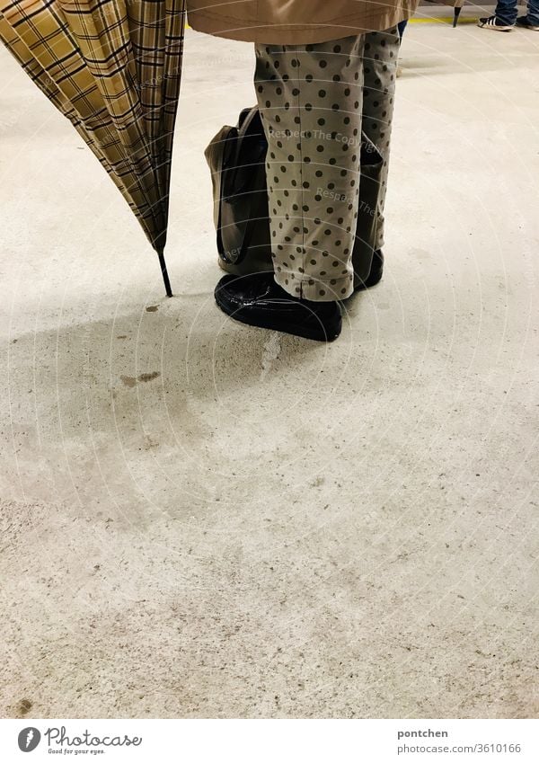 Pattern mix- dots and checks. Lower body of an older woman with umbrella. Fashion, style. pattern mix Umbrella Pants Spotted Checkered bingham lower body Legs