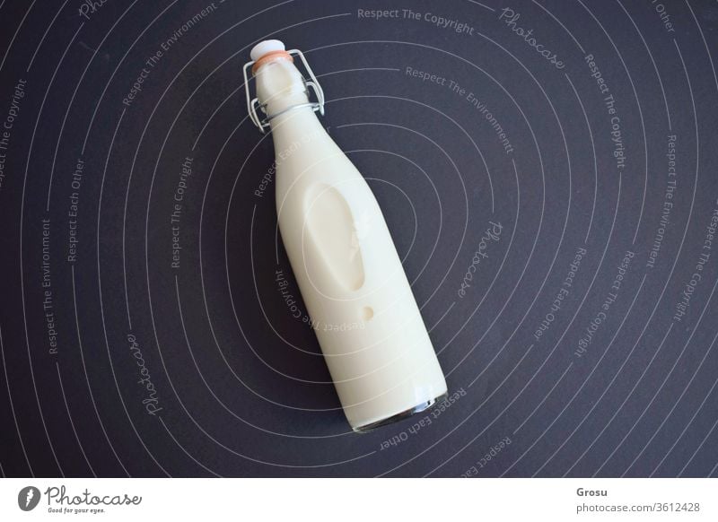 Isolated milk bottle on dark background with copy field for text White objects med Close-up Beverage Black Blank bottles brand Breakfast calcium Clean Container