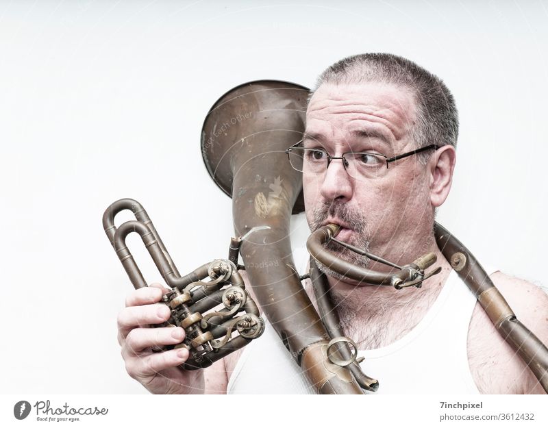 Squinty man in undershirt with broken tenor horn Man exempt Brass instrument Cor anglais Undershirt Eyeglasses Facial hair Person wearing glasses Adults Funster