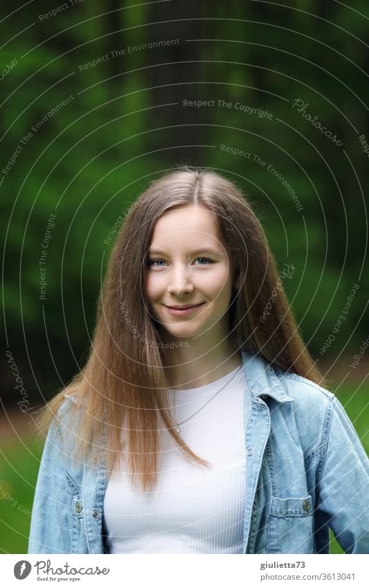 Portrait of a pretty smiling teenage girl with long hair, in the park portrait Shadow Light Day Exterior shot Colour photo Puberty Emotions Long-haired Spring