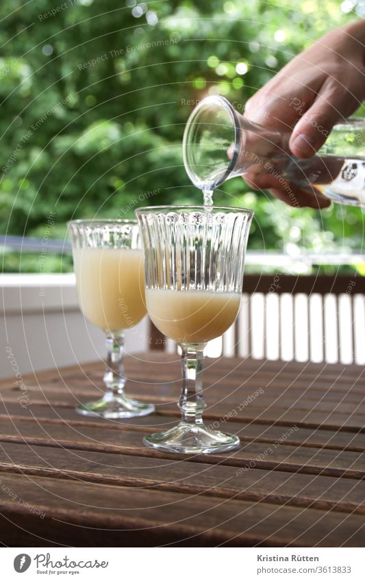 man pours pastis with water from a carafe Aperitif Beverage Alcoholic drinks anise anis schnapps booze spirit drink Water Carafe Mix infuse Mixture milky