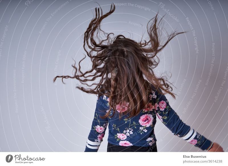 Hair flying around Hair and hairstyles Head Human being Child girl Back Infancy Colour photo sleeves Flying Jump pleased excited Hop studio recording Crazy