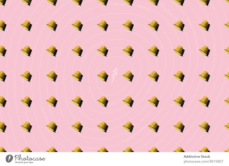 Pattern of coffee capsules on pink background pattern seamless pod row even delicious repeat aroma composition fresh arrangement color vibrant vivid bright