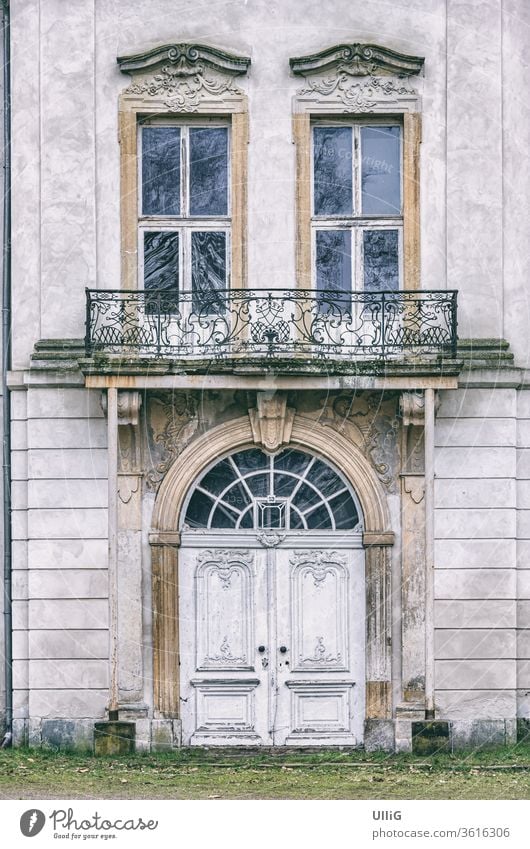 Main Portal Of A Dilapidated Manor House - Main portal of a dilapidated manor house, Ivenack, Mecklenburg Pomerania, Germany. door entrance facade exterior