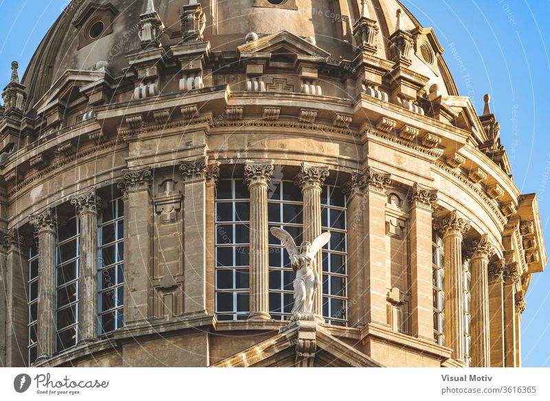 Decorative angel, big windows and Corinthian columns of the dome of National Art Museum of Catalonia in Barcelona aka MNAC decorative corinthian ornament