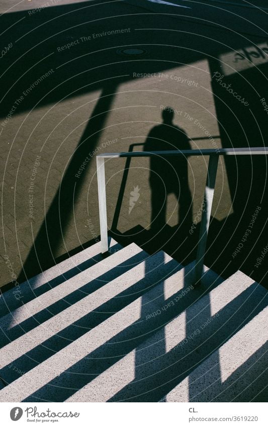 stairs and shadow of a person Stairs stagger Handrail Banister Man Architecture great Downward Sharp-edged Anonymous Shadow Exterior shot