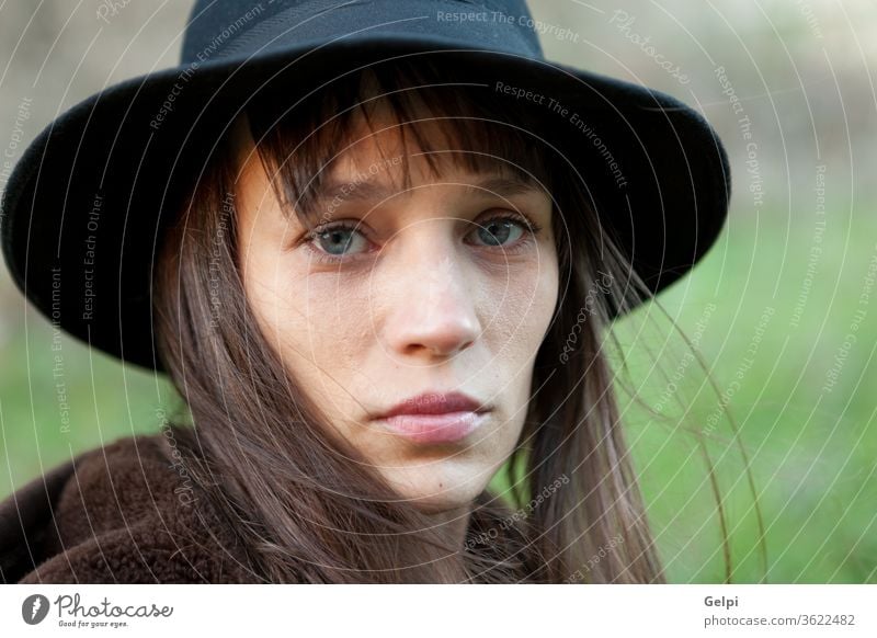 Sad woman with black hat beautiful sad person portrait young lifestyle girl female pretty beauty attractive people fall caucasian autumn model lady face outdoor