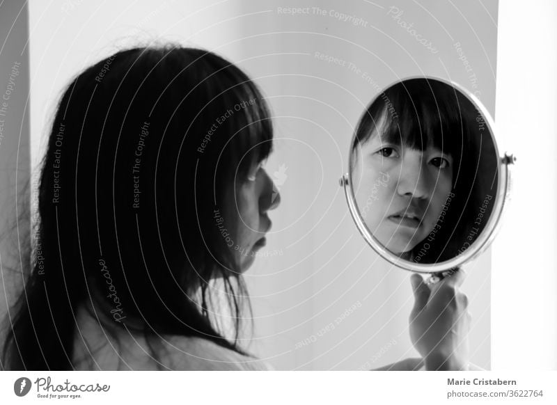 Asian woman looking at the mirror on her reflection self love conceptual portrait mirror reflection Human being Woman Mirror image Feminine Young woman