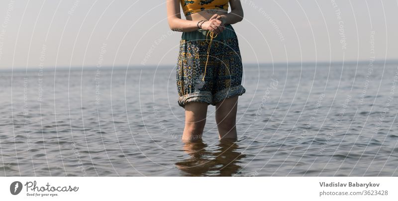 Lady stands in the water women Girl Water Legs SEA seaside Lake