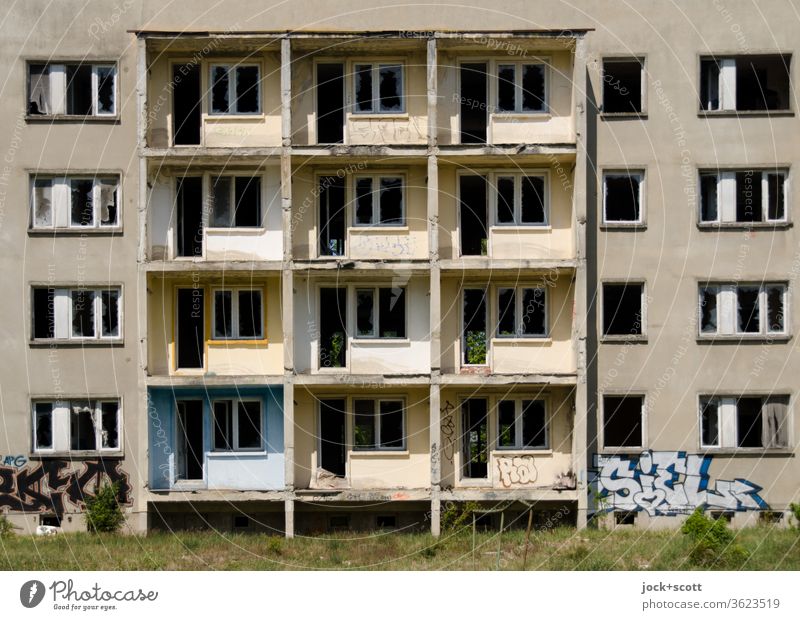 Panel building, away from the window GDR Uninhabited Vacancy House (Residential Structure) Vista Gloomy Agreed Symmetry Ruin Apocalyptic sentiment Sunlight Old