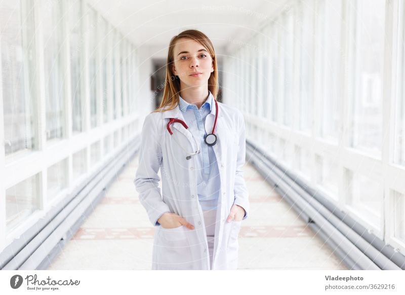 Portrait of a beautiful young female doctor with stethoscope in the clinic Healthy med youthful Woman Doctor Stethoscope Nurse medicine portrait Specialist girl