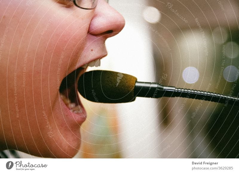 Close up mouth of a schoolchild screaming into a microphone bub Child School Microphone cry Loud Scream yell Cry for help furious Fear Boy (child) Mouth Infancy