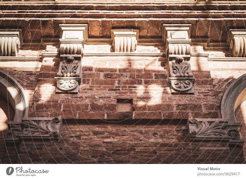 Neoclassical capital on the cornice of an old red brick building neoclassical facade ancient architecture ornamental authentic century heritage civilization