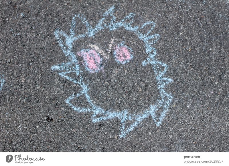 Child's drawing with street chalk monster . COVID-19, Corona Virus Children's drawing covid-19 corona virus Monster child's world Infancy Processing Fear