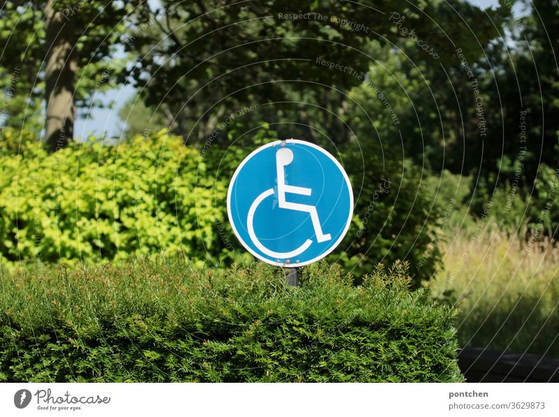 There is a round sign in a bush with a wheelchair user in it. disabled parking Signage wheelchair users handicap Drawing bbüscj Signs and labeling