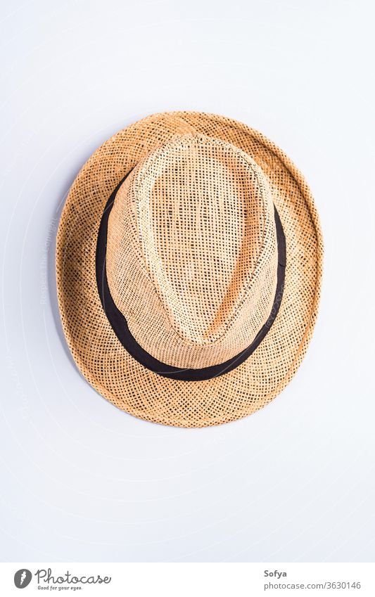 Straw hat on neutral gray background summer straw flat lay vertical fashion wear head overhead item object symbol sun protection lifestyle accessory clothing
