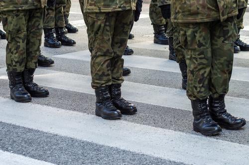 Soldiers standing on the street in a military uniform with camouflage and black military boots soldiers troops combat boots boot camp platoon veterans day