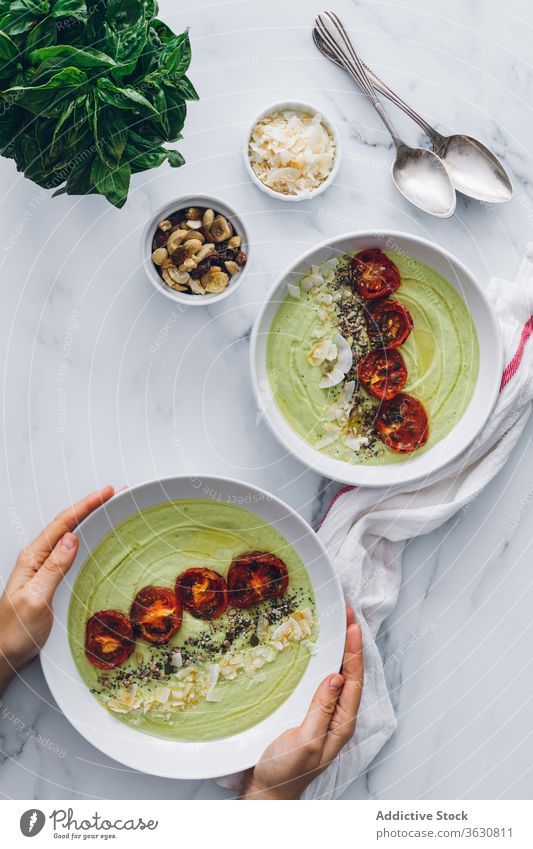 Tasty avocado and apple cream soup with tomatoes and coconut food meal gastronomy tasty lunch cuisine vegetarian sun dried fresh basil gourmet exquisite
