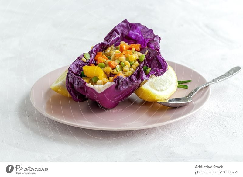 Tasty vegan taco with mix of peppers in cabbage leaf food gastronomy vegetarian lemon gourmet exquisite dinner purple dish colorful portion delicatessen